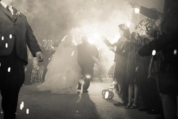 Bride and groom leaving to a sparkler send off after their wedding reception at Saratoga Mountain Winery.